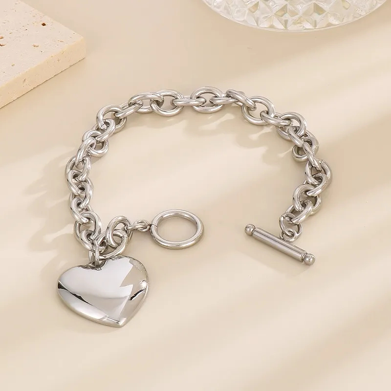 Fashionable and Minimalist Stainless Steel Smooth Heart Pendant with an Ot Buckle Bracelet Necklace Set
