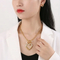 Fashionable Hollowed-out Diamond-Encrusted Heart Pendant Women's Stainless Steel Necklace and Earring Set
