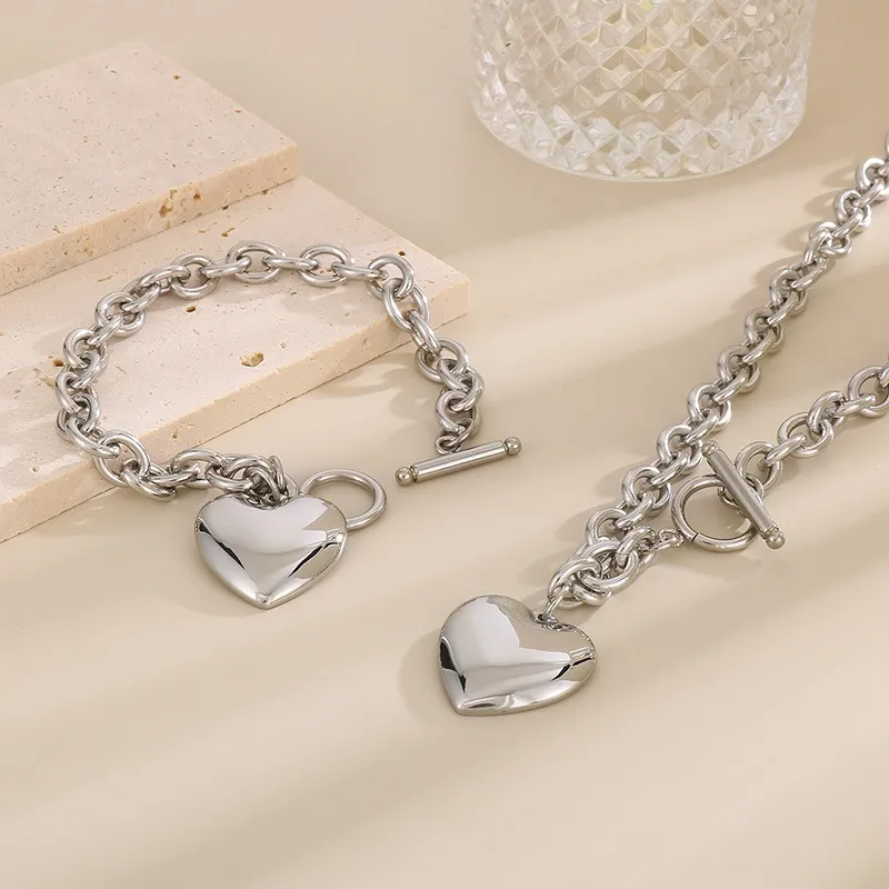 Fashionable and Minimalist Stainless Steel Smooth Heart Pendant with an Ot Buckle Bracelet Necklace Set